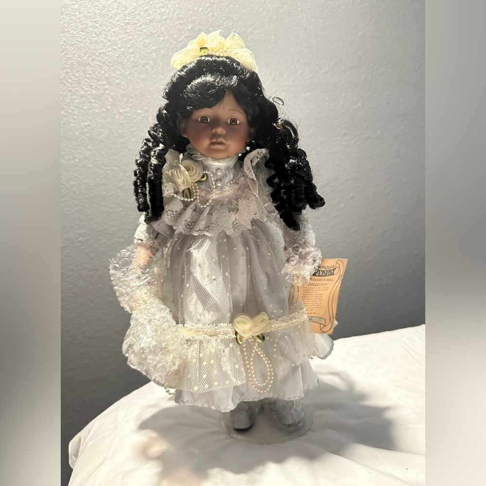 Elegant Porcelain Doll with Black Hair and White Dress